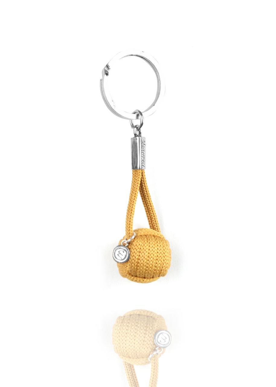 Mustard yellow Monkey ball keychain medal Moataz Designs